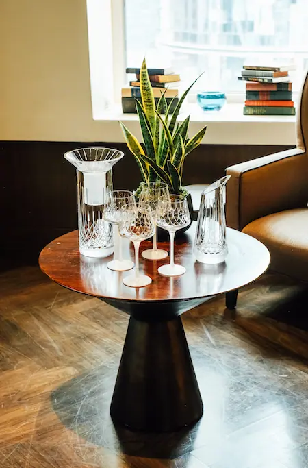 crystal wine glasses on a small side table