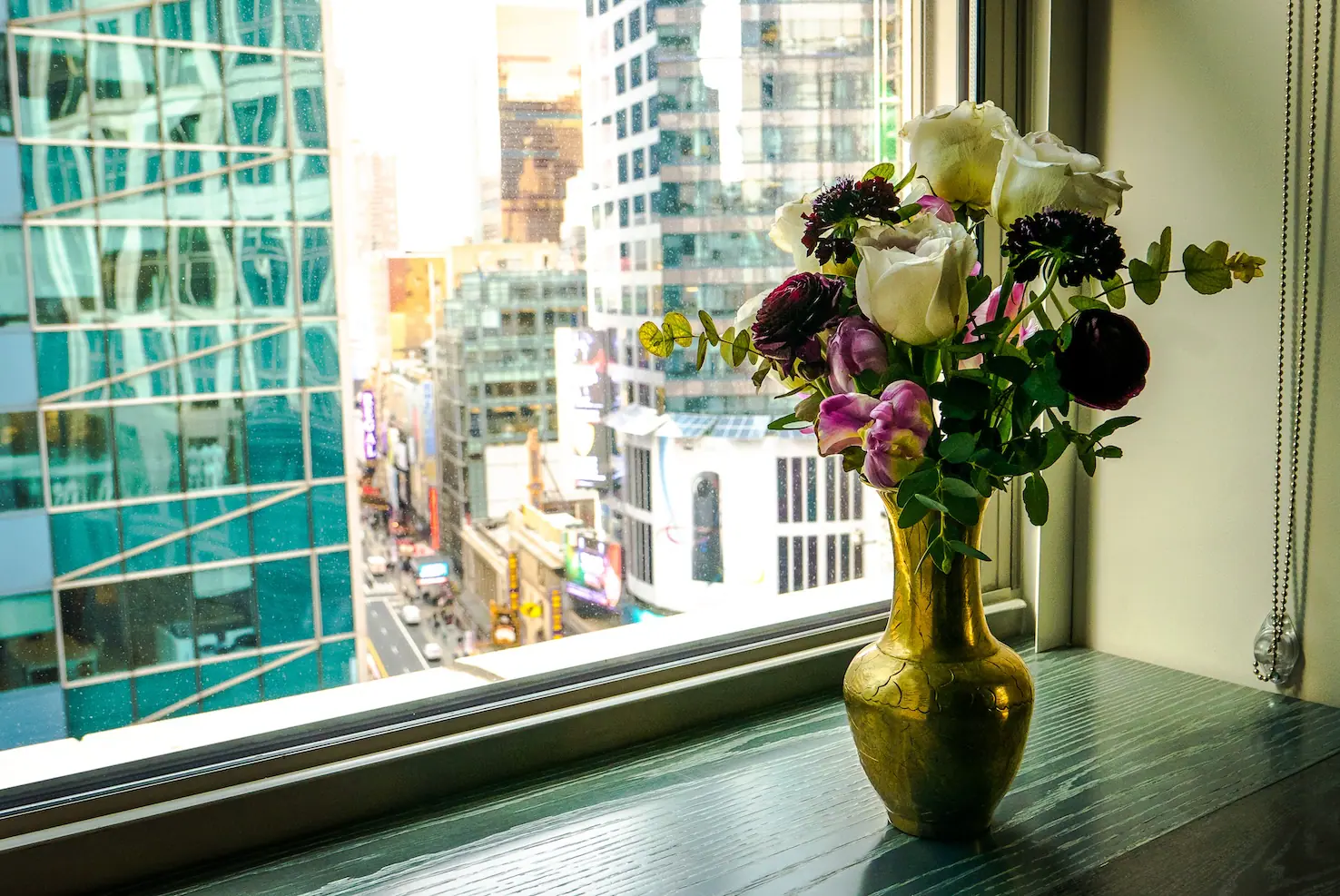 flowers on a table by a window