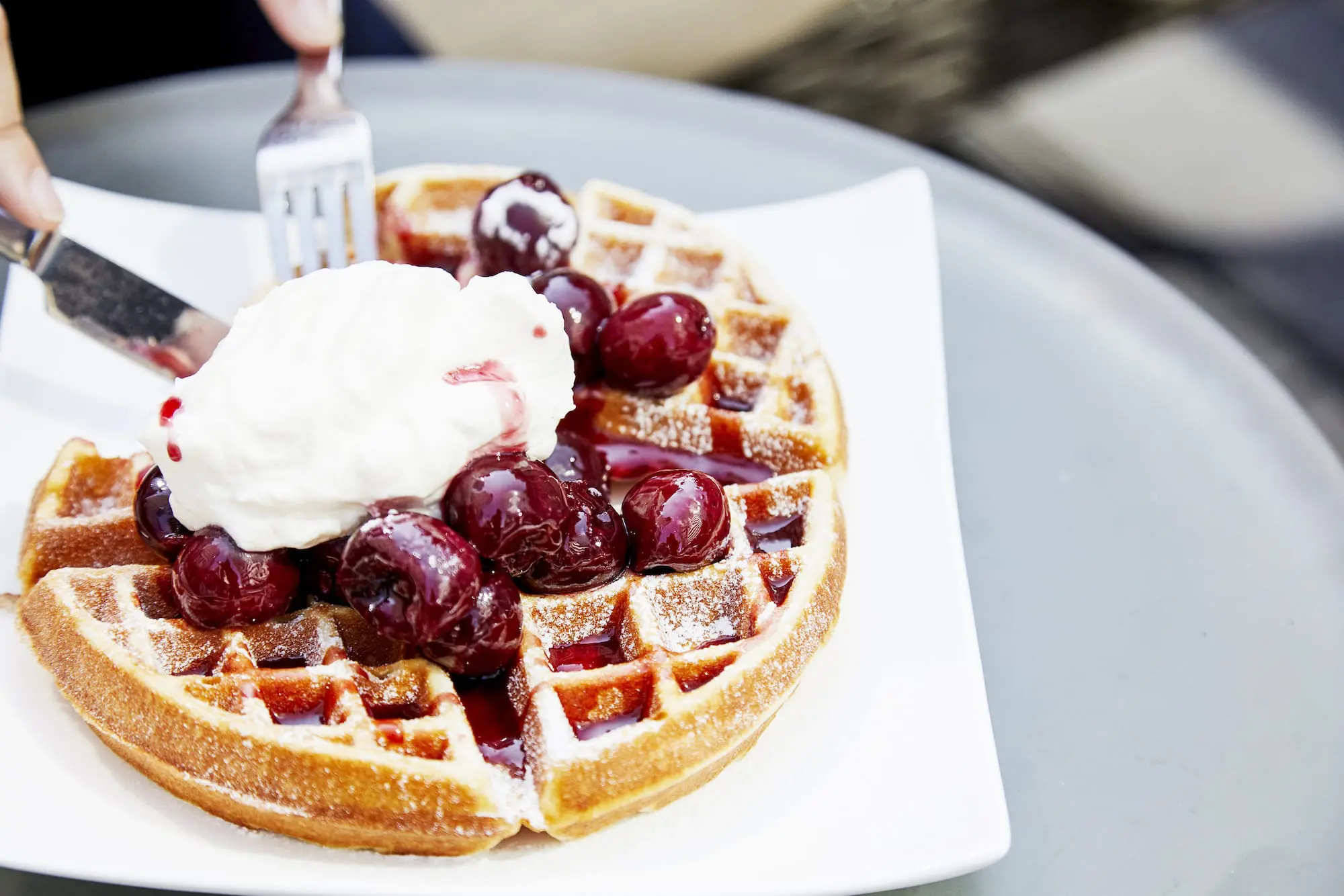waffle, berries, and whipped cream