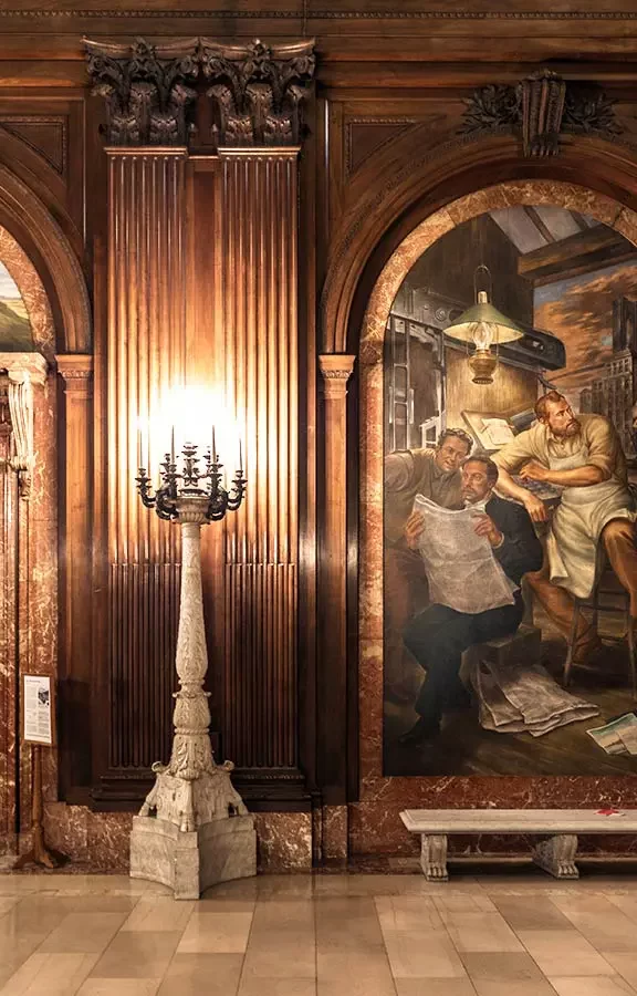 a room with floor to ceiling paintings