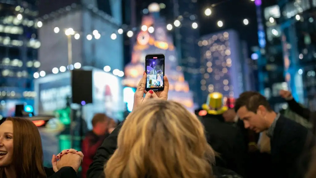 a person taking a photo of NYC