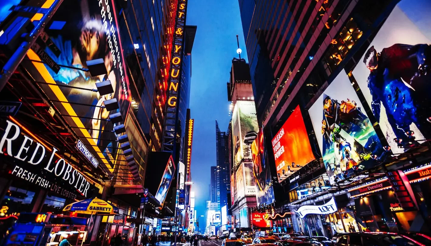 Times Square at night with bright billboards