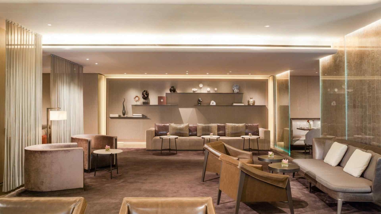 A luxurious hotel lobby with comfortable seating and decorative elements.