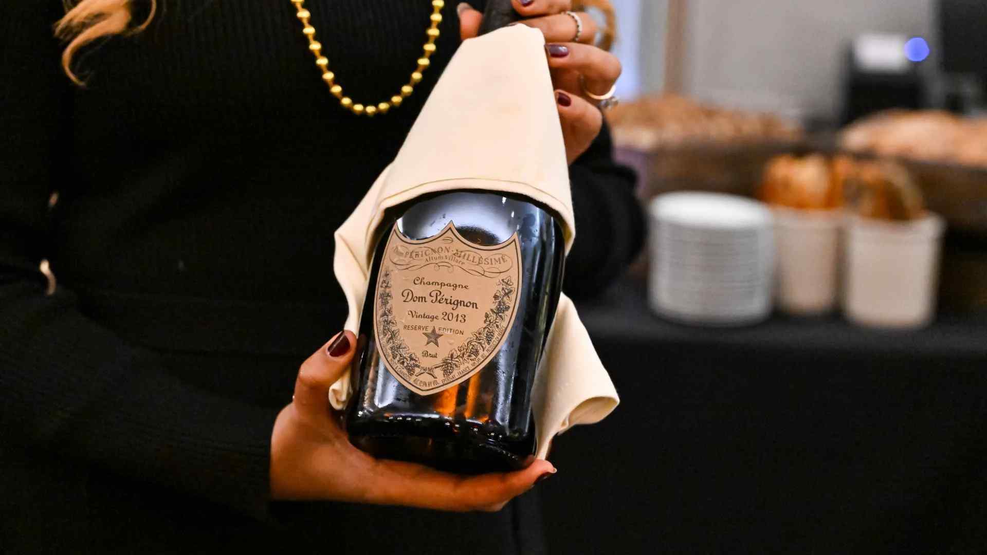 A server pouring some Dom Perignon on New Years Eve